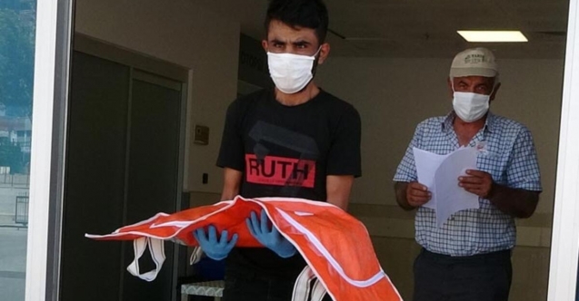 4 aylık bebeğinin cenazesini kucağında taşıdı