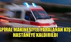 Spiral makinesiyle tahta keserken yaralandı
